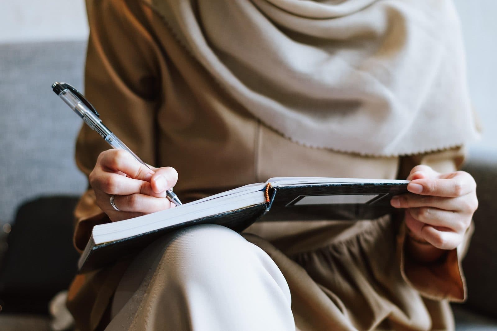 A member preparing notes for a live speaking session
